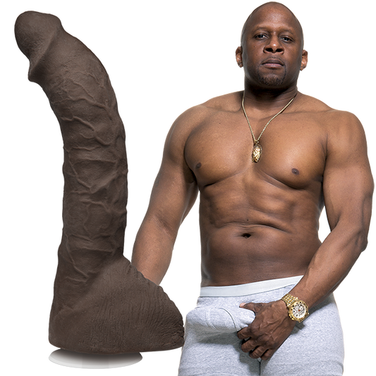 A shirtless Prince shown next to the Signature Cocks - Prince Yahshua dildo. The dildo is lifecast directly from his own length. | Kinkly Shop