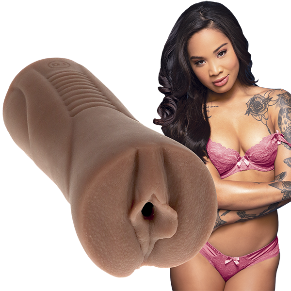 Honey Gold, in lingerie, stares seductively at the camera while the Signature Strokers - Honey Gold, molded after her parts, is shown right next to her. | Kinkly