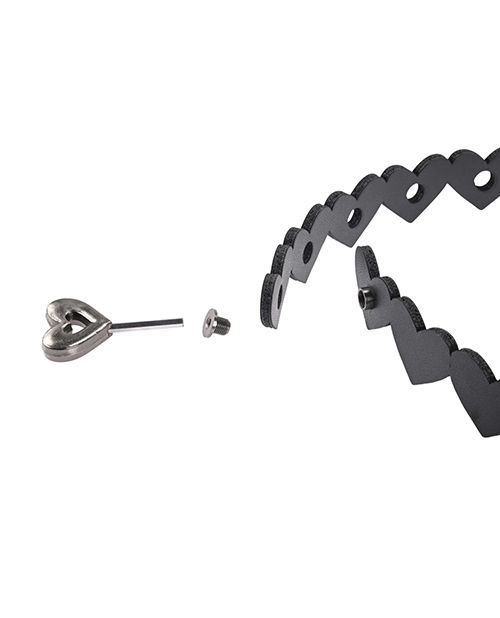 The heart-shaped hex code key shown unlocking the two sides of the Sportsheets Heart Day Collar from one another. There's no clear buckle on the collar; just the discreet hex key lock spot. | Kinkly Shop