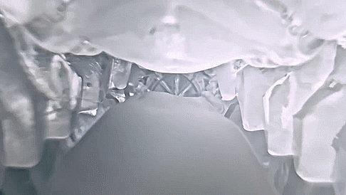 GIF showcases the interior texture of the white Tenga Flip Zero. A camera slides inside of the stroker, showing the different textures inside the stroker as it travels to the triangular, textured rubbing ball at the end of the stroker. | Kinkly Shop