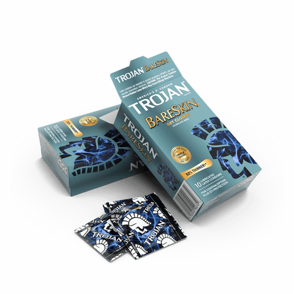 An opened box of 10 condoms with some of the individually-wrapped condoms scattered near it. | Kinkly