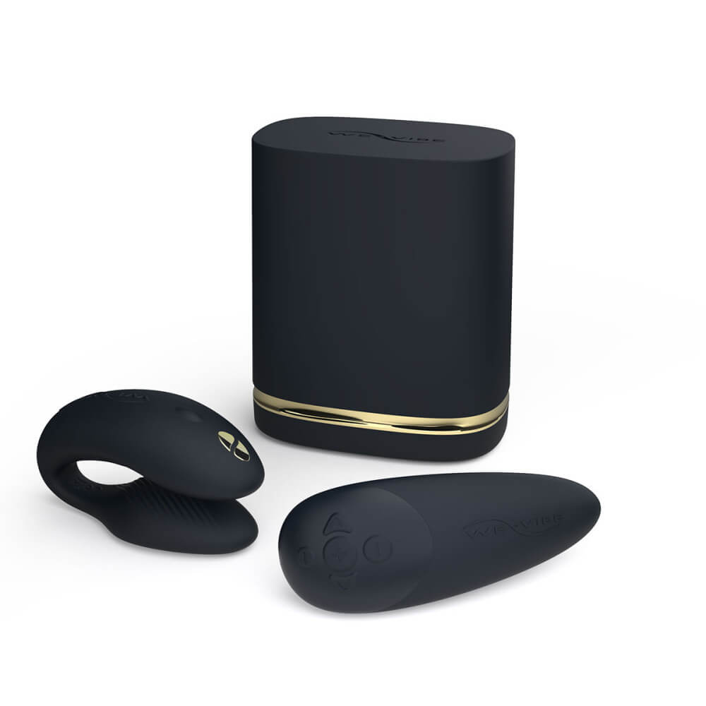 The We-Vibe Chorus vibrator laying next to its storage/charging case and the squeeze remote that comes with it. | Kinkly Shop