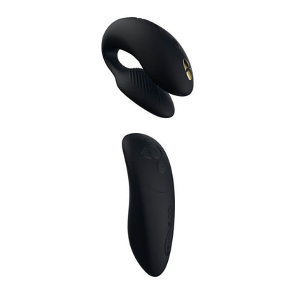 The We-Vibe Chorus U-shaped vibrator next to the squeeze remote that controls it. It has a black/gold color scheme. | Kinkly Shop