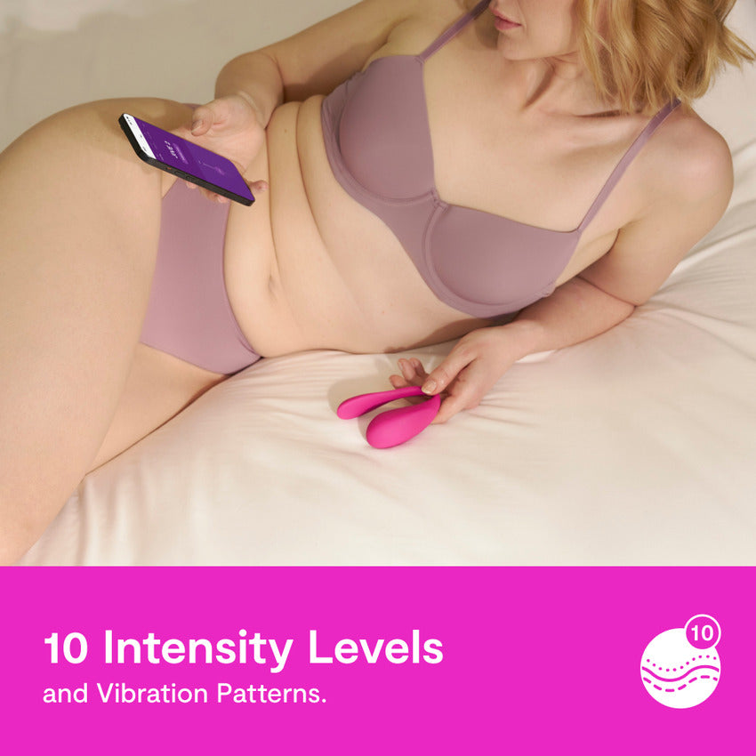A person is holding the We-Vibe Jive 2 and a cell phone. Text on the image reads: "10 Intensity Levels and vibration patterns." | Kinkly Shop