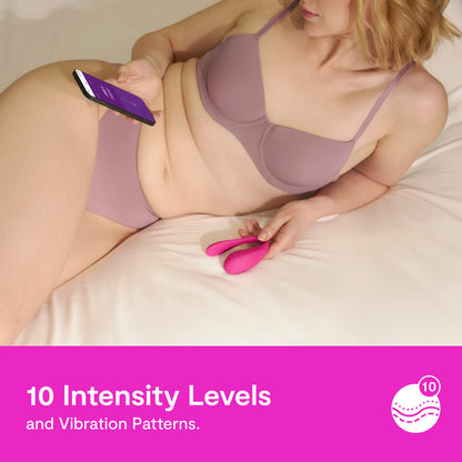 A person is holding the We-Vibe Jive 2 and a cell phone. Text on the image reads: "10 Intensity Levels and vibration patterns." | Kinkly Shop