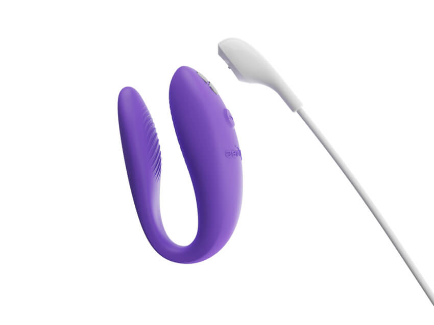 Close-up of the magnetic charging cable shown about to connect to the vibrator, showcasing how the toy charges. | Kinkly Shop