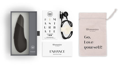 Everything included with the Womanizer Enhance. There's the instruction booklet, charging cable, warranty info, and drawstring storage bag. | Kinkly Shop