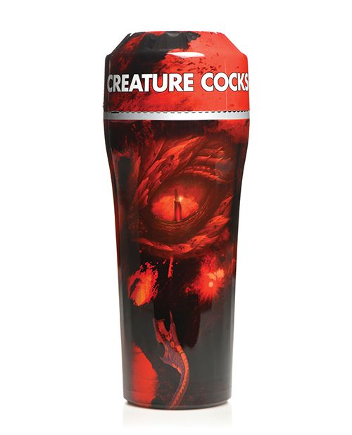 The Creature Cocks Dragon Snatch sitting upright against a plain white background with all of the colorful, dragon-featured plastic wrapping still on it. It has lots of reds and blacks with images of the dragon all over it. | Kinkly Shop
