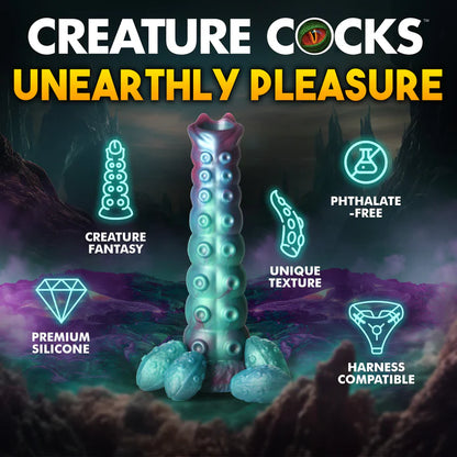 The Creature Cocks Galactic Breeder Ovipositor shown next to a list of text and icons that describe it. Text reads: Creature fantasy. Premium silicone. Unique texture. Phthalate-free. Harness compatible. | Kinkly Shop