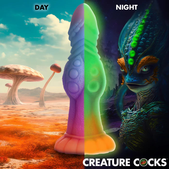Two images of the Creature Cocks Galactic Cock, showcasing what the dildo looks like in both night and day. | Kinkly Shop