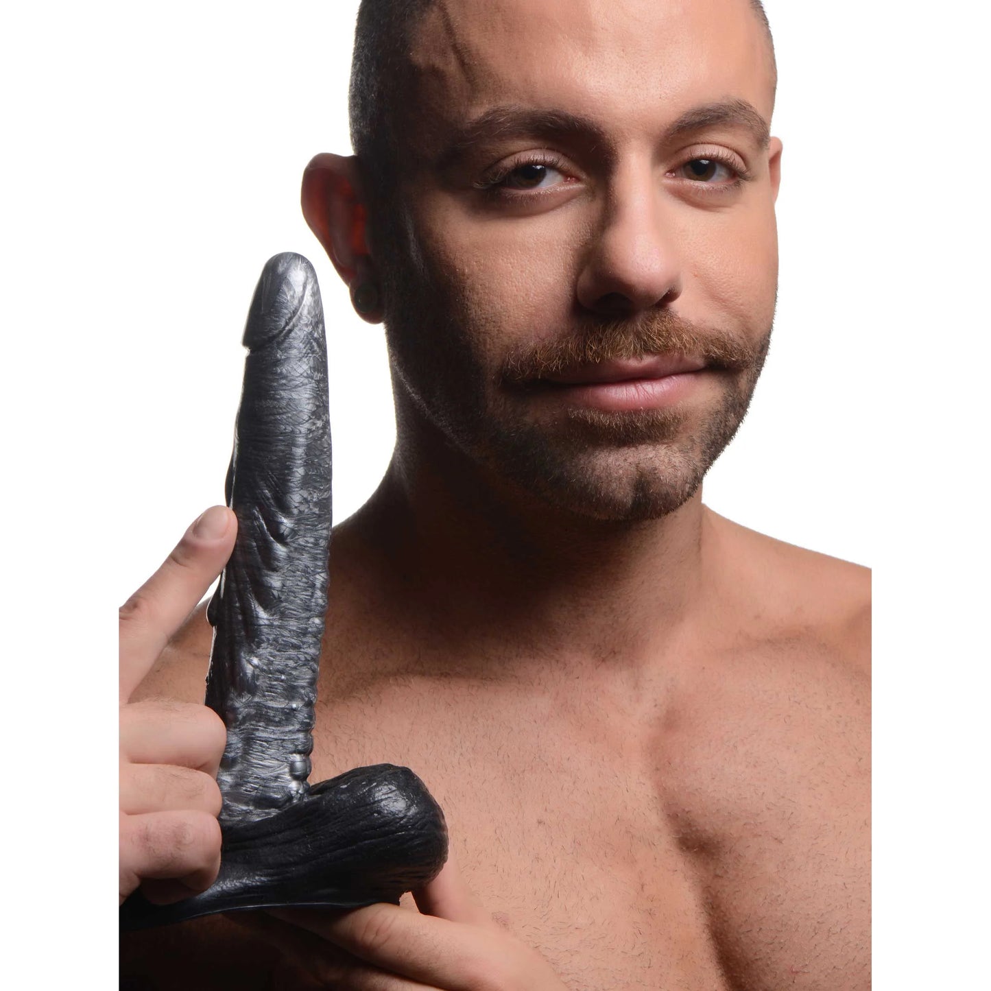 A person holds the Creature Cocks Gargoyle. The dildo looks long and slender in their hands. | Kinkly Shop