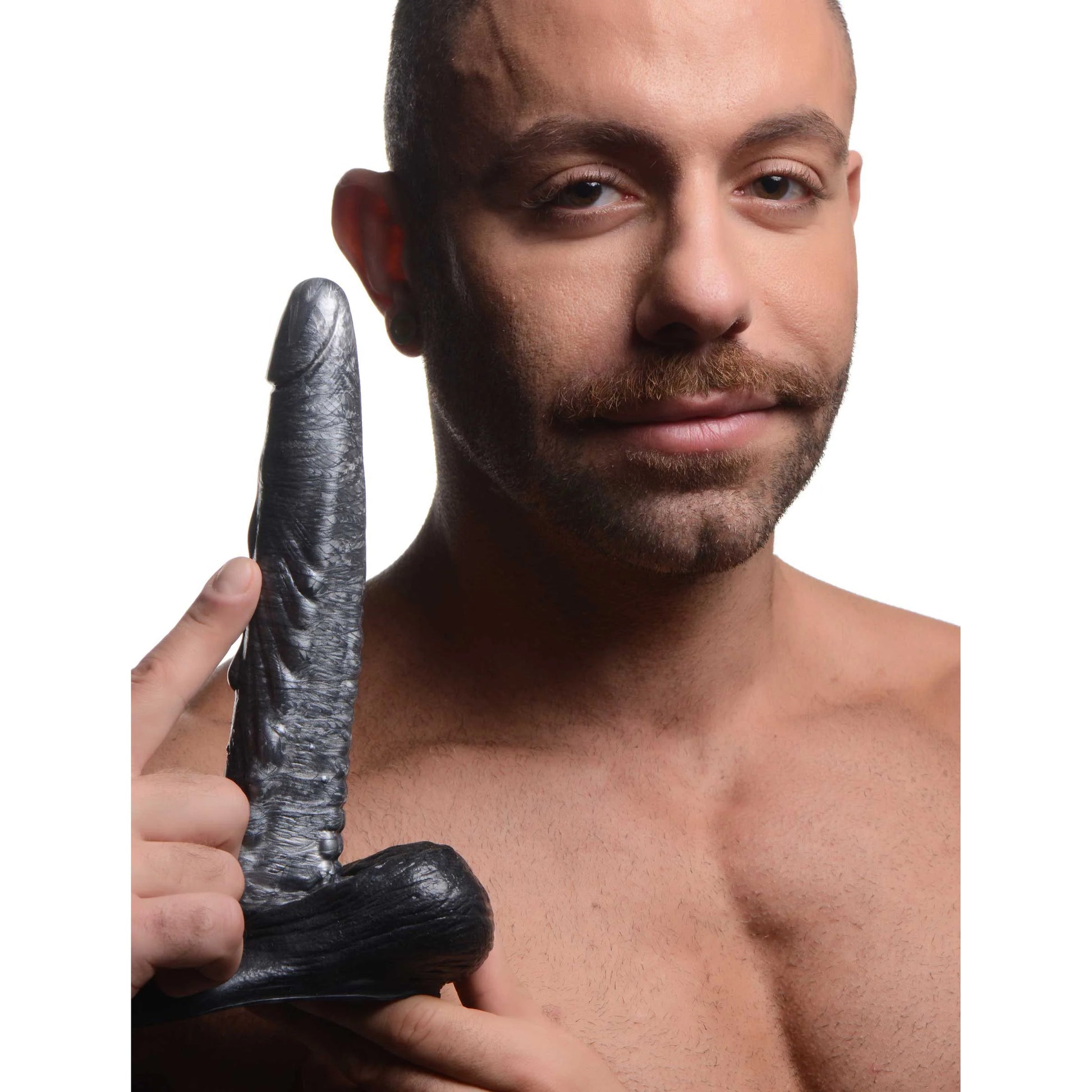 A person holds the Creature Cocks Gargoyle. The dildo looks long and slender in their hands. | Kinkly Shop