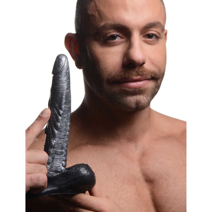 A person holds the Creature Cocks Gargoyle. The dildo looks long and slender in their hands. | Kinkly Shop