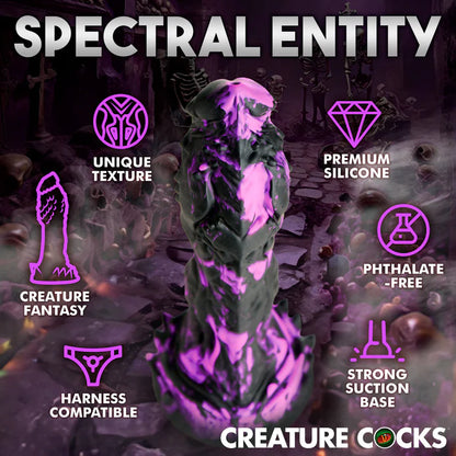 The Creature Cocks Grim shown next to a list of icons and text that describe its features. Text reads: "Unique texture. Creature fantasy. Harness compatible. Premium silicone. Phthalate free. Strong suction base" | Kinkly Shop