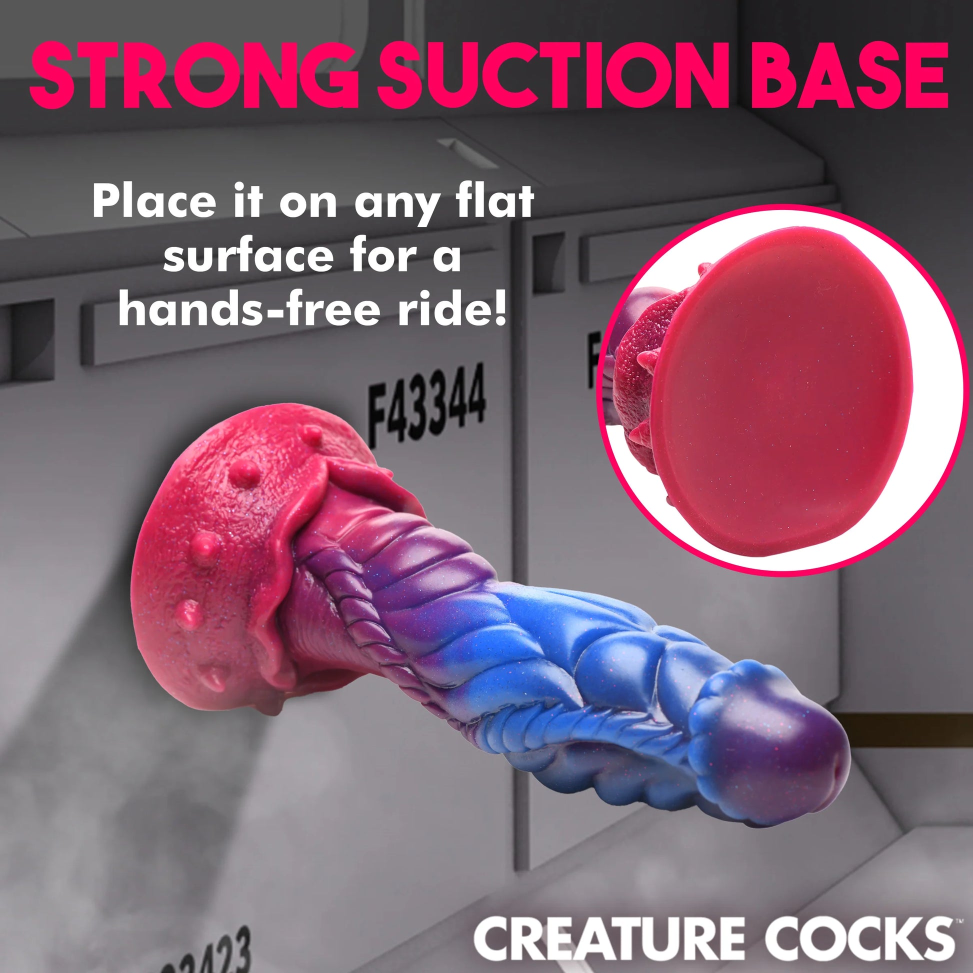 The Creature Cocks Intruder is stuck to the side of official-looking space boxes. Text on the image reads: Strong suction base. Place it on any flat surface for a hands-free ride" | Kinkly Shop