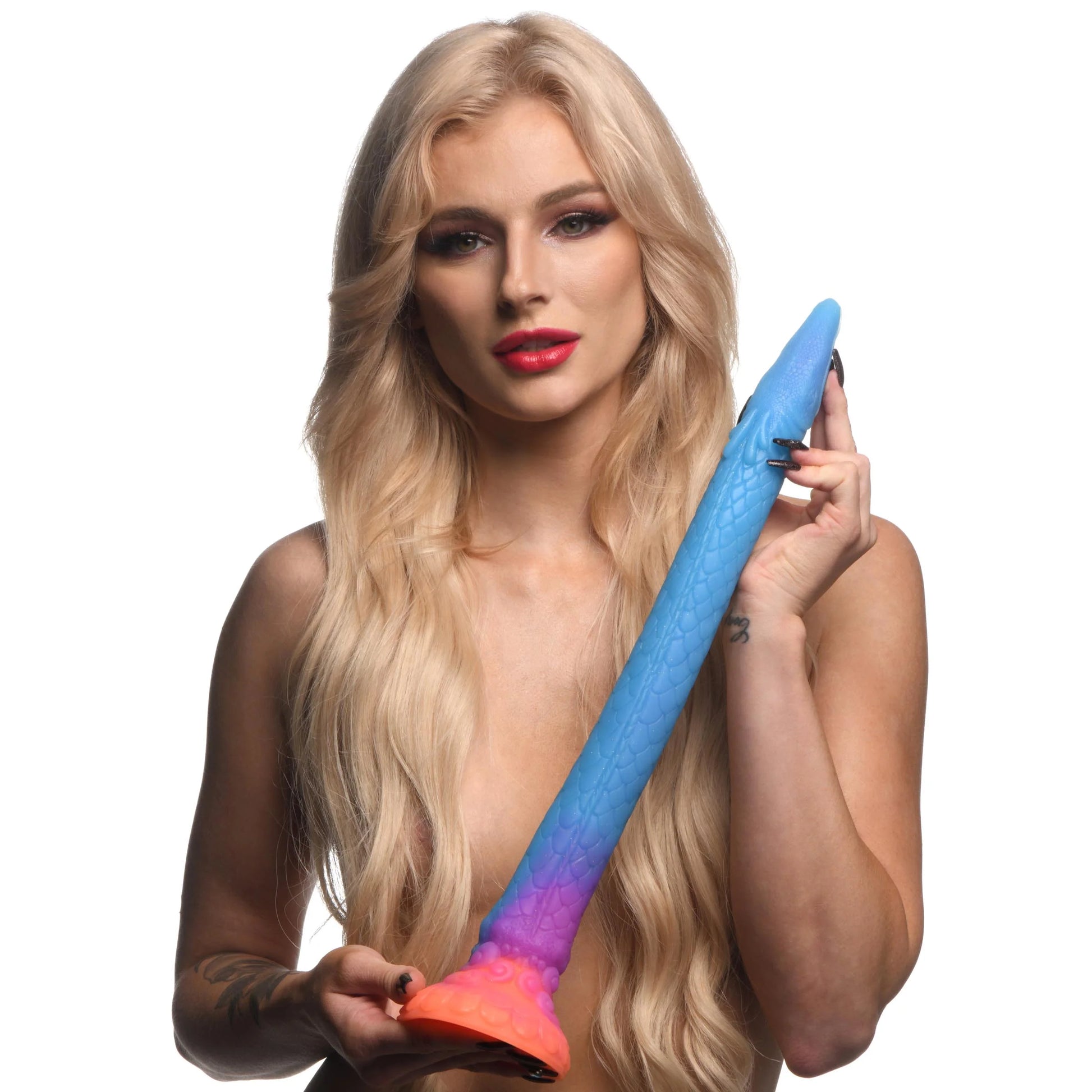 A person is holding the Creature Cocks Makara. The dildo is particularly long, extending from the bottom of the person's ribcage all the way past their shoulder. | Kinkly Shop