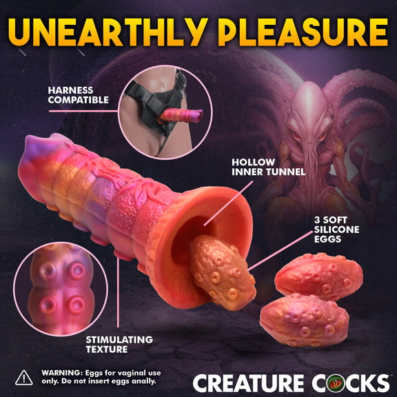 Collage of images showcases features of the Creature Cocks Nymphoid Ovipositor with Eggs including its harness compatibility, stimulating texture, hollow inner tunnel, and 3 included soft silicone eggs. The eggs are for vaginal use only. Do NOT insert anally. | KInkly Shop