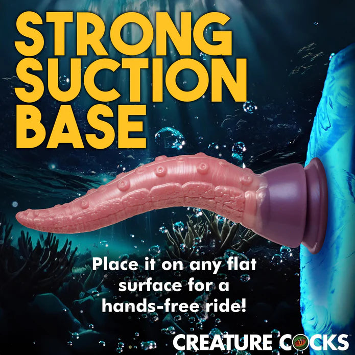 The Creature Cocks Octoprobe shown adhered to a flat surface. The text on the image reads: "Strong suction base. Place it on any flat surface for a hands-free ride." | Kinkly Shop