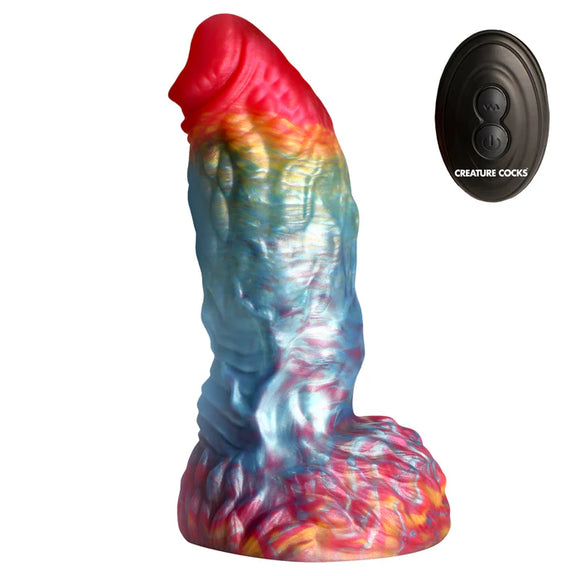 The Creature Cocks Phoenix Vibrating Remote-Control Dildo shown next to the included remote control that controls the vibrations. | Kinkly Shop