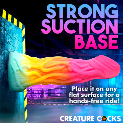 The Creature Cocks Shifter is shown suctioned up to a vertical flat surface. Text reads "Strong suction base. Place it on any flat surface for a hands-free ride" | Kinkly Shop