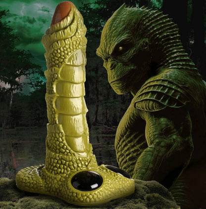 The Giant Swamp Monster Scaly Dildo shown next to the scaly monster that the toy is based off of. | Kinkly Shop