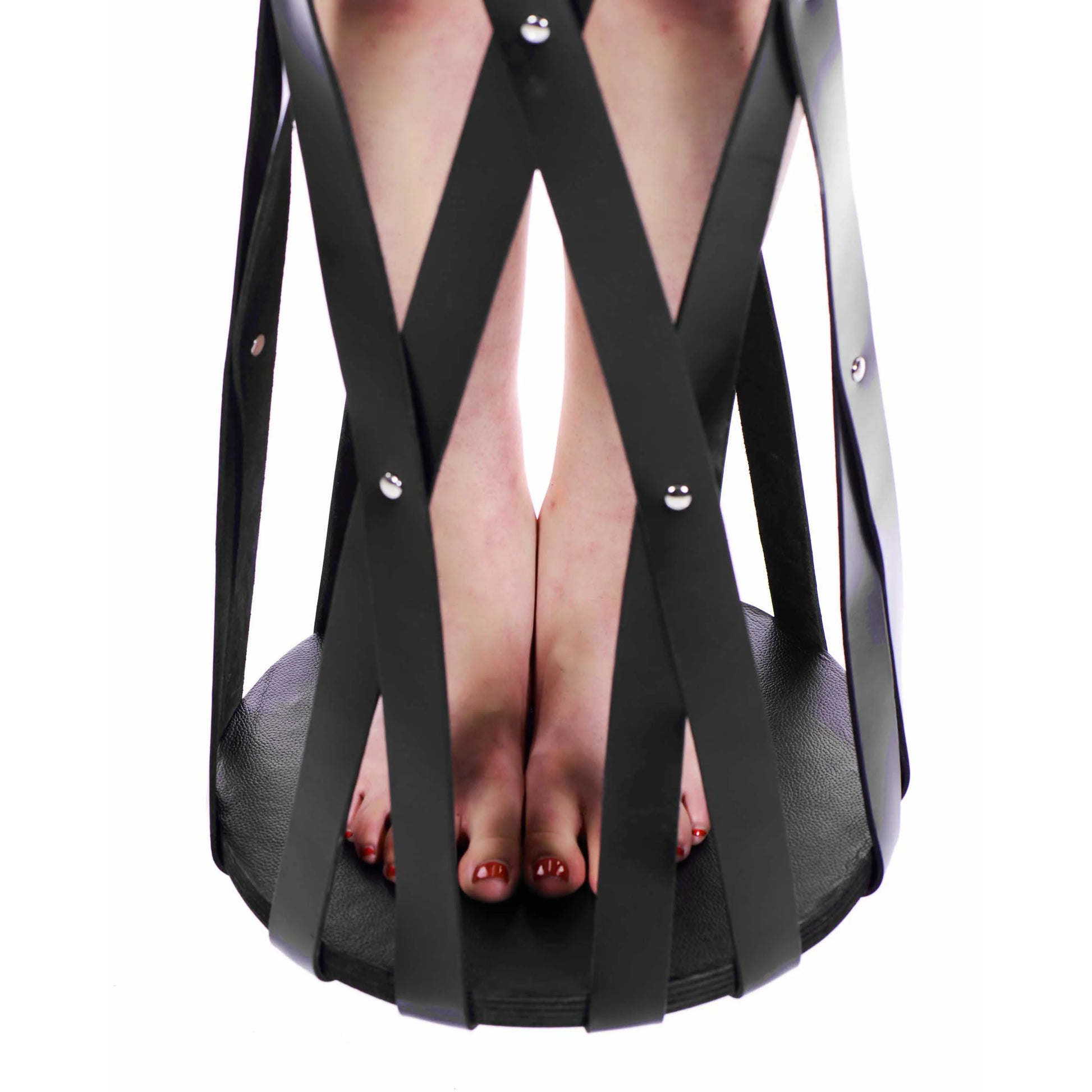 Close-up on the wooden, flat board at the base of the Hanging Leather Strap Cage that offers a comfortable standing platform for the person. | Kinkly Shop