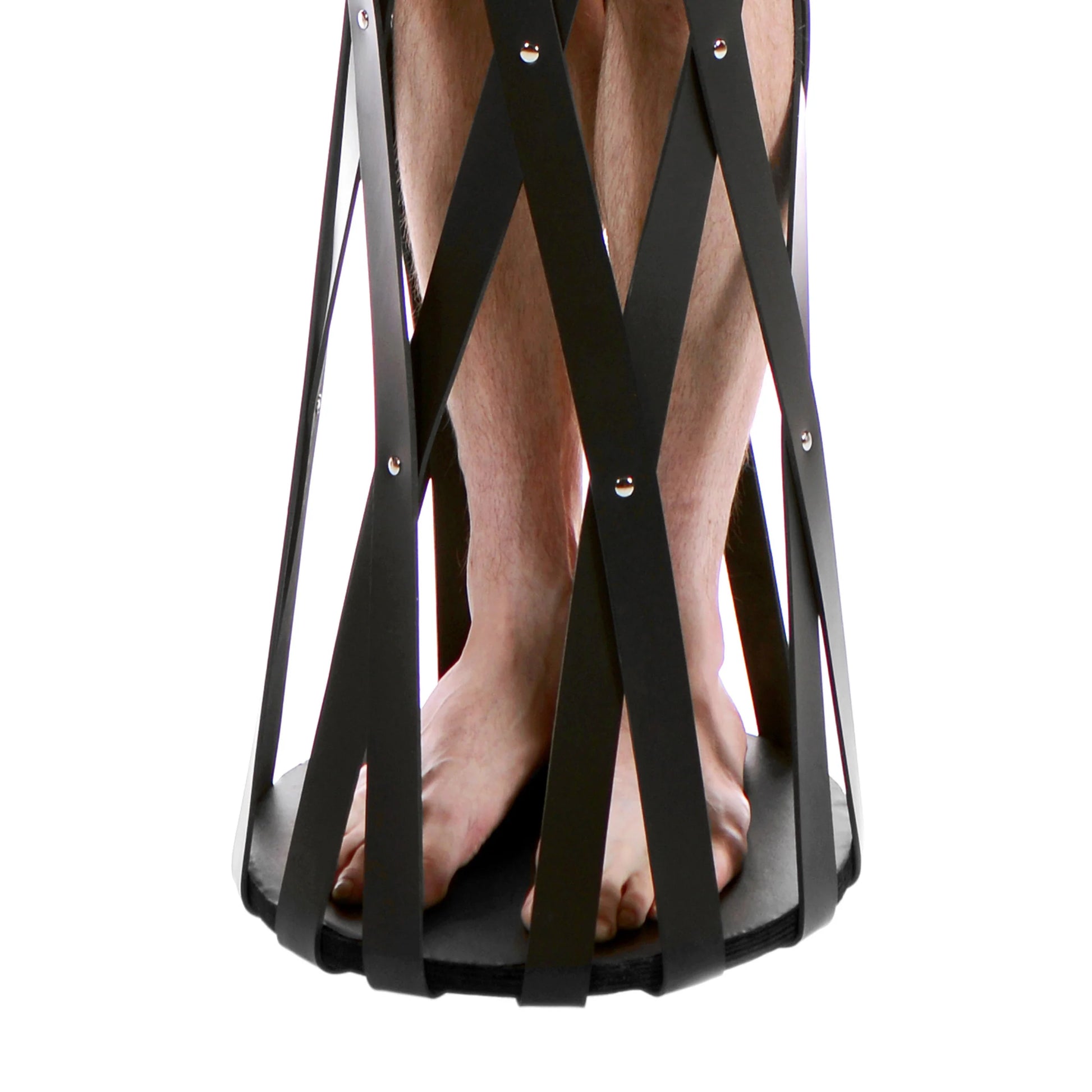 Close-up on the base of the cage that showcases the wooden, flat, sturdy base that the person can stand on while in the cage. | Kinkly Shop