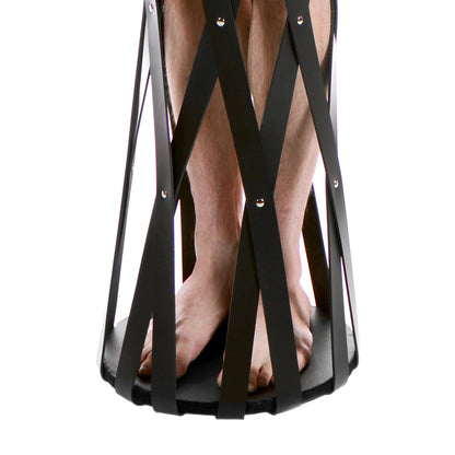 Close-up on the base of the cage that showcases the wooden, flat, sturdy base that the person can stand on while in the cage. | Kinkly Shop