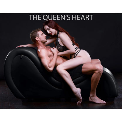The penetration partner is seated at the lowest point on the Kinky Couch Bondage Sex Chaise. The receiving partner straddles them, on their lap, for penetration while facing one another. | Kinkly Shop