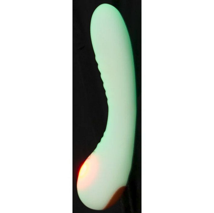 The You2Toys Glow-in-the-Dark G-Spot shown against a black background, showcasing what the green coloration looks like while glowing in the dark. | Kinkly Shop