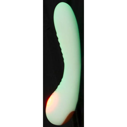 The You2Toys Glow-in-the-Dark G-Spot shown against a black background, showcasing what the green coloration looks like while glowing in the dark. | Kinkly Shop