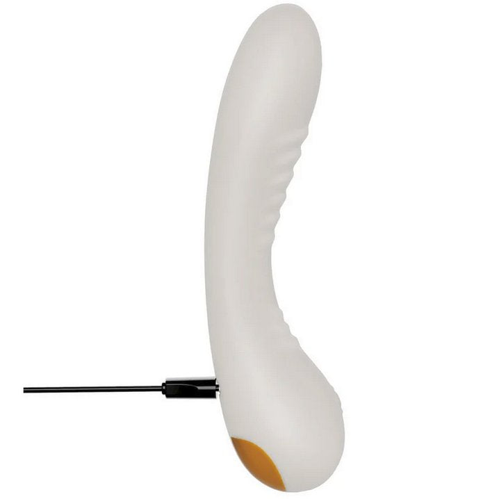 The You2Toys Glow-in-the-Dark G-Spot with the charging cable connected at the base of the vibrator. | Kinkly Shop