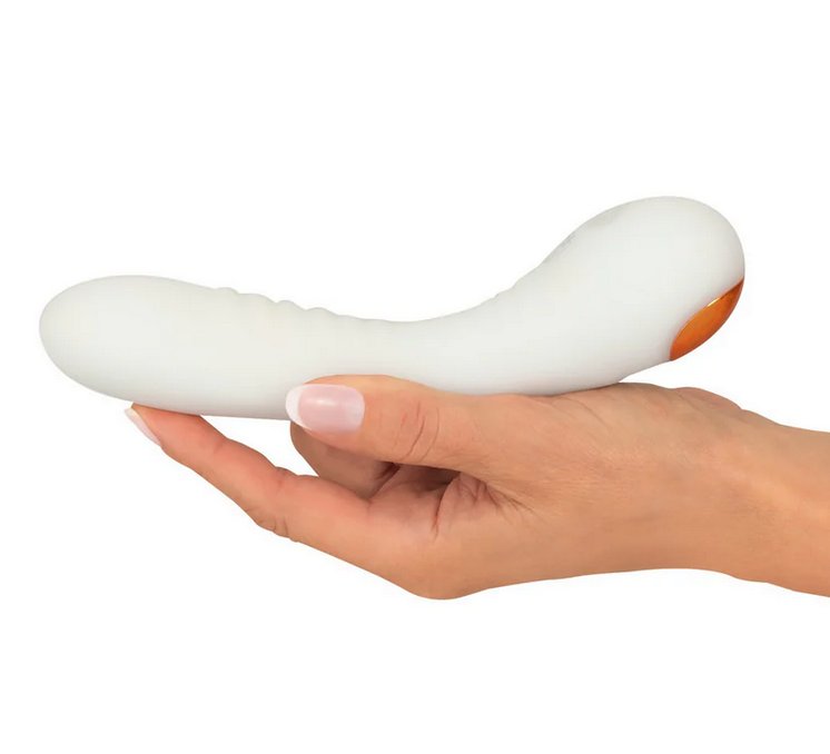 A hand cradles the You2Toys Glow-in-the-Dark G-Spot, showcasing the length of the toy. The g-spot vibrator is slightly longer than the person's outstretched hand by about an inch. | Kinkly Shop