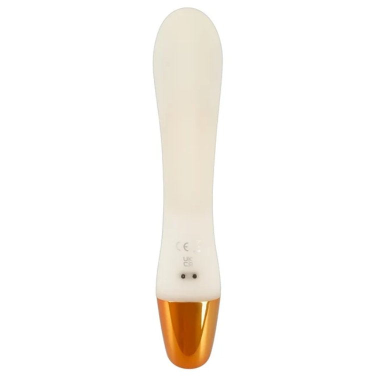 Backside of the You2Toys Glow-in-the-Dark Rabbit. There are two metal dots near the base of the toy that showcase where the magnetic charger attaches to the vibrator. | Kinkly Shop