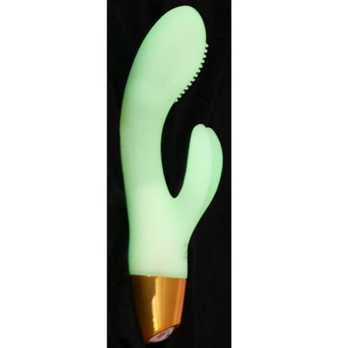 The You2Toys Glow-in-the-Dark Rabbit vibrator against a black background, showcasing what the vibrator looks like when its doing its glow-in-the-dark functionality. | Kinkly Shop