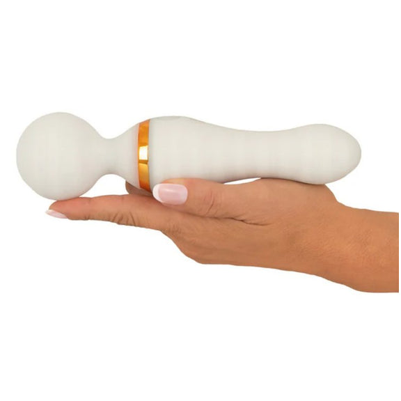 A hand is lying flat, showcasing how long the massager is. The You2Toys Glow-in-the-Dark Wand Vibrator is longer than the person's outstretched hand by a little less than an inch. | Kinkly Shop