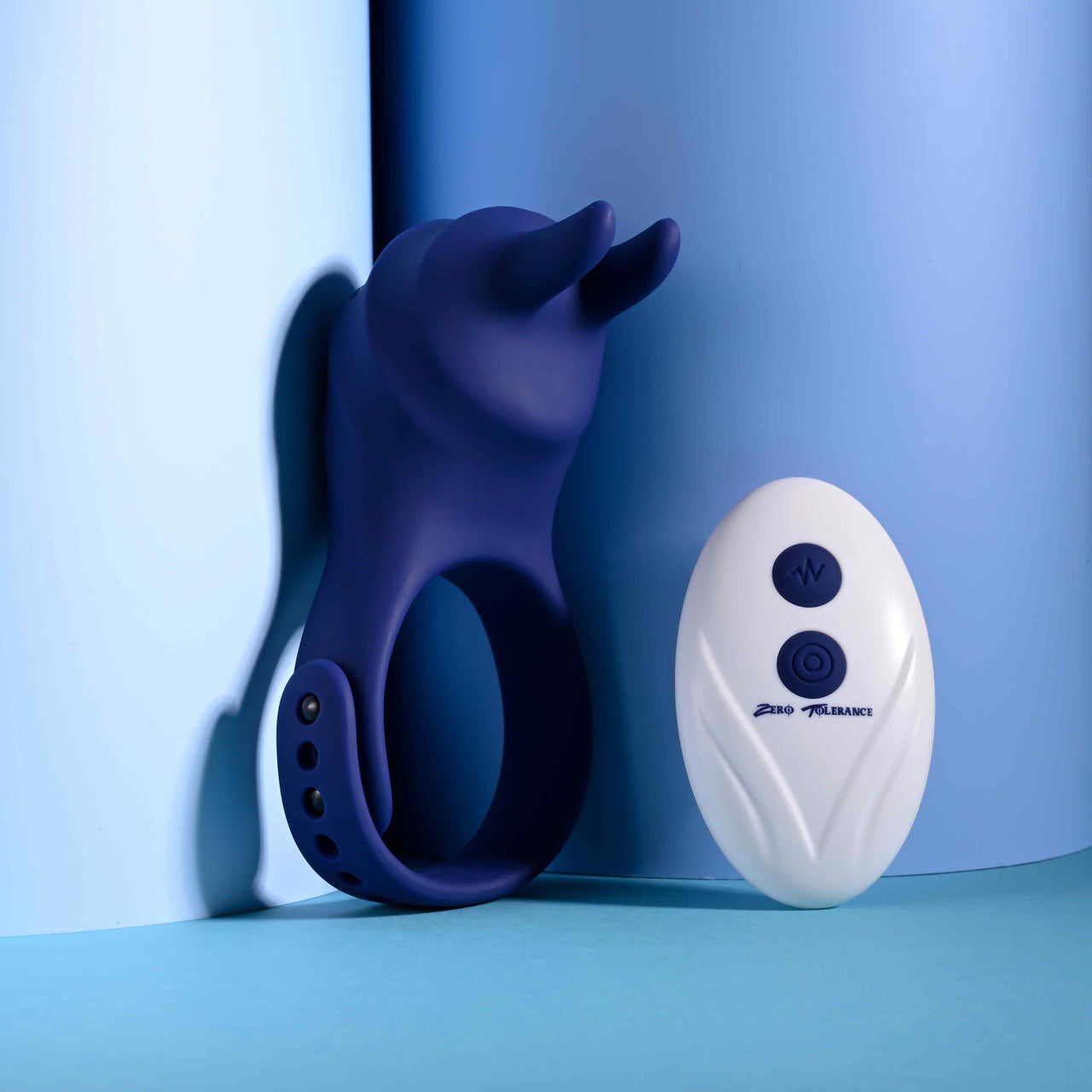 The Zero Tolerance Adjustable Fun Ring shown next to the remote control that controls the vibrations of the cock ring. | Kinkly Shop