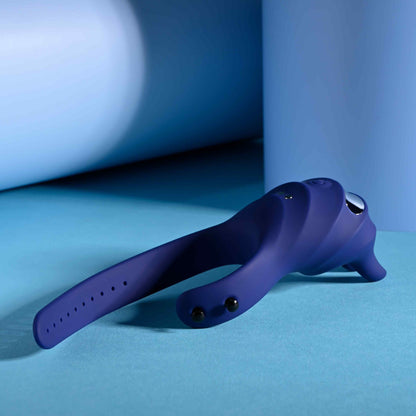 The Zero Tolerance Adjustable Fun Ring laying flat on the ground with the ring entirely unfastened. The cock ring has an adjustable loop like a belt loop. | Kinkly Shop