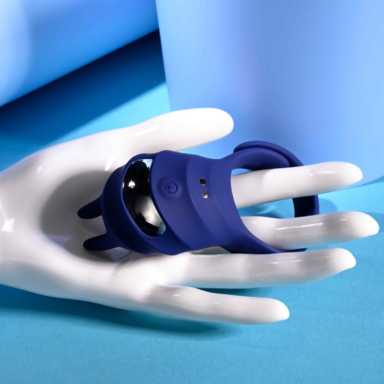The Zero Tolerance Adjustable Fun Ring wrapped around the fingers of a mannequin hand. Two fingers fit in the ring just fine with a ton of excess room to spare. | Kinkly Shop