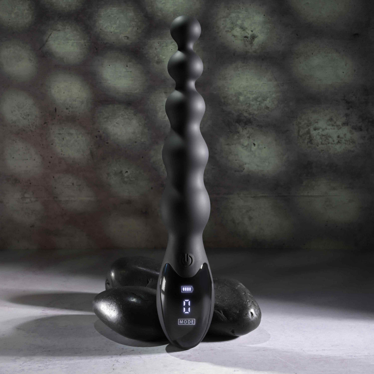 The Zero Tolerance Backdoor Baton with the LED control panel at the base turned on. It shows the battery level and the current number mode it's on. | Kinkly Shop