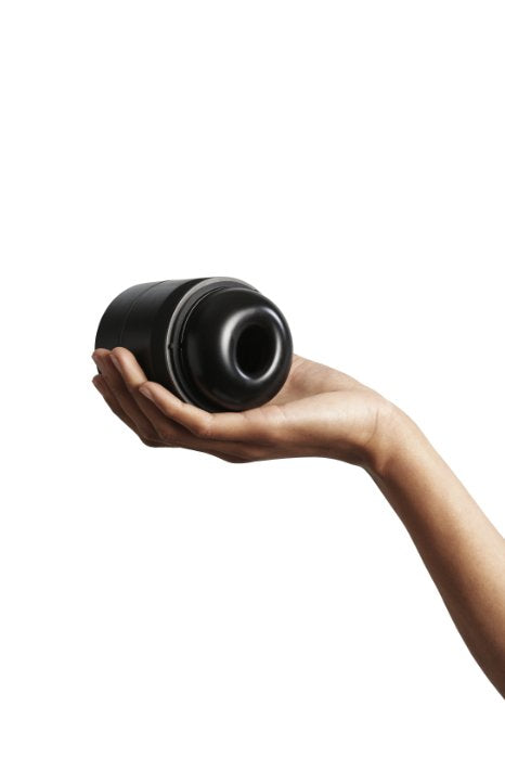 A hand holds the Arcwave Voy. It fits comfortably in the palm and the fingers wrap easily around it. | Kinkly Shop