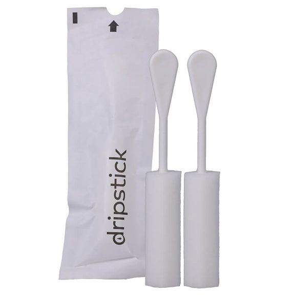 Two of the Awkward Essentials Dripsticks shown next to its disposable, single-use packaging to help protect the Dripstick until you use it. | Kinkly Shop