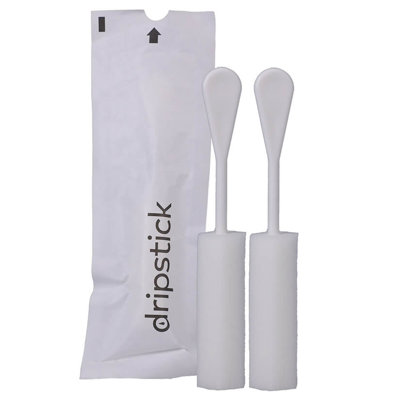 Two of the Awkward Essentials Dripsticks shown next to its disposable, single-use packaging to help protect the Dripstick until you use it. | Kinkly Shop