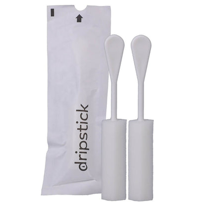 Two of the Awkward Essentials Dripsticks shown next to its disposable, single-use packaging to help protect the Dripstick until you use it. | Kinkly Shop
