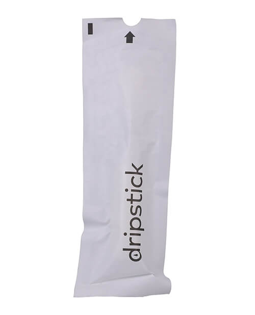 The single use, discreet packaging of the Awkward Essentials Dripsticks. It is pure white and almost looks like a medical product. This will allow the Dripstick to travel virtually anywhere for easy, disposable use when needed. | Kinkly Shop