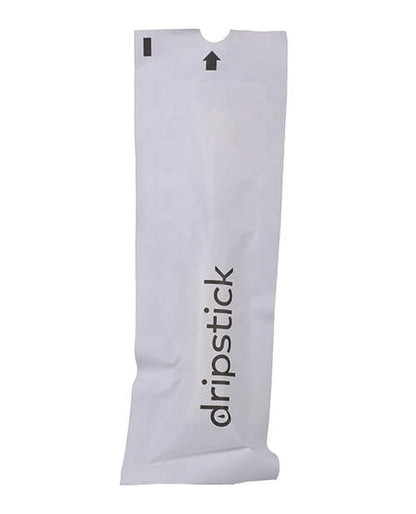 The single use, discreet packaging of the Awkward Essentials Dripsticks. It is pure white and almost looks like a medical product. This will allow the Dripstick to travel virtually anywhere for easy, disposable use when needed. | Kinkly Shop