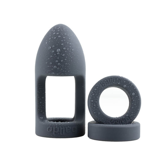 The Balldo in Steel Grey next to its two spacer rings. Drops of water are on the surface of the toy. | Kinkly Shop