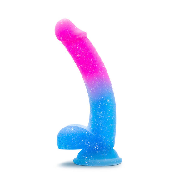 Blush Avant Chasing Sunsets dildo up against a white background. The top half of the dildo is a hot pink which ombres into a light blue on the bottom half of the dildo. The entire dildo sparkles. | Kinkly Shop