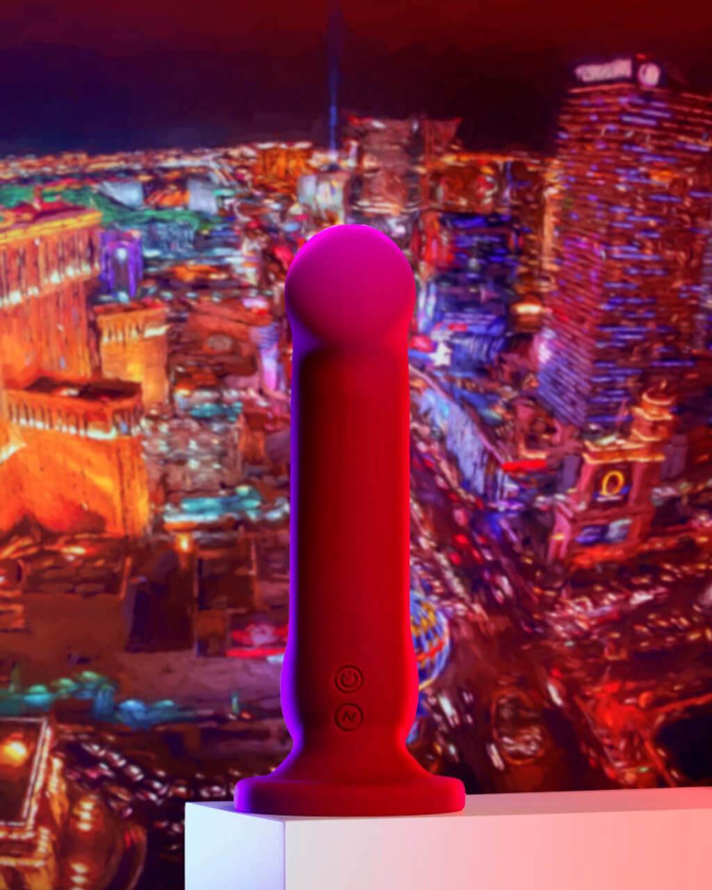 The Blush Impressions Las Vegas sits on a table in front of a picture of a busy, bustling city. | Kinkly Shop