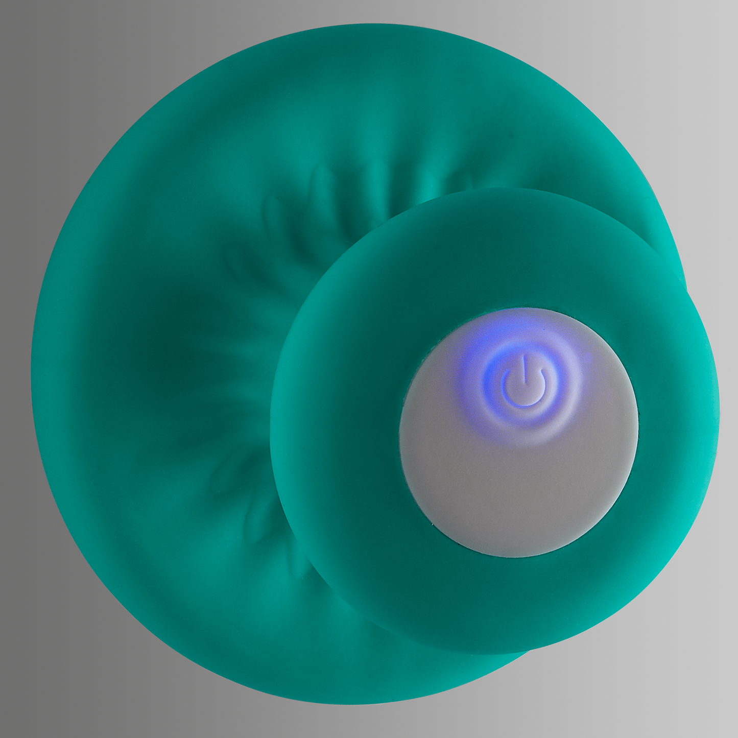 Bottom view showing the glowing light of the power button that turns on during use of the Cloud 9 Mushroom Massager | Kinkly Shop